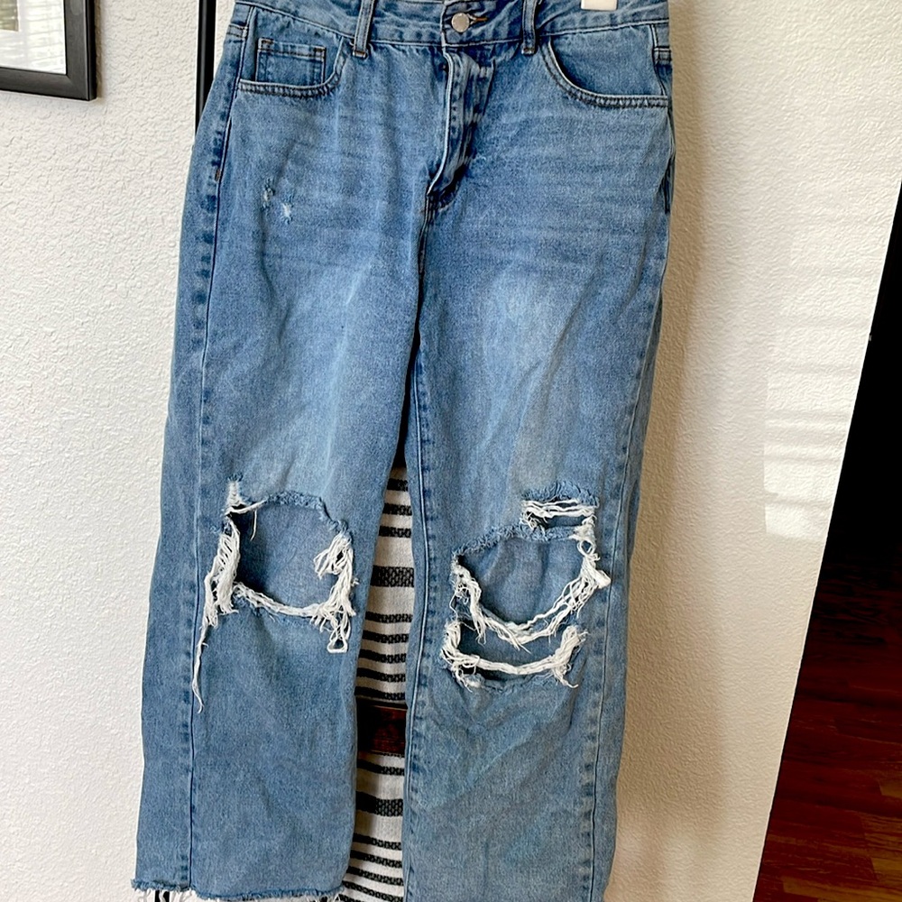 Pair of women’s size large wide leg jeans,